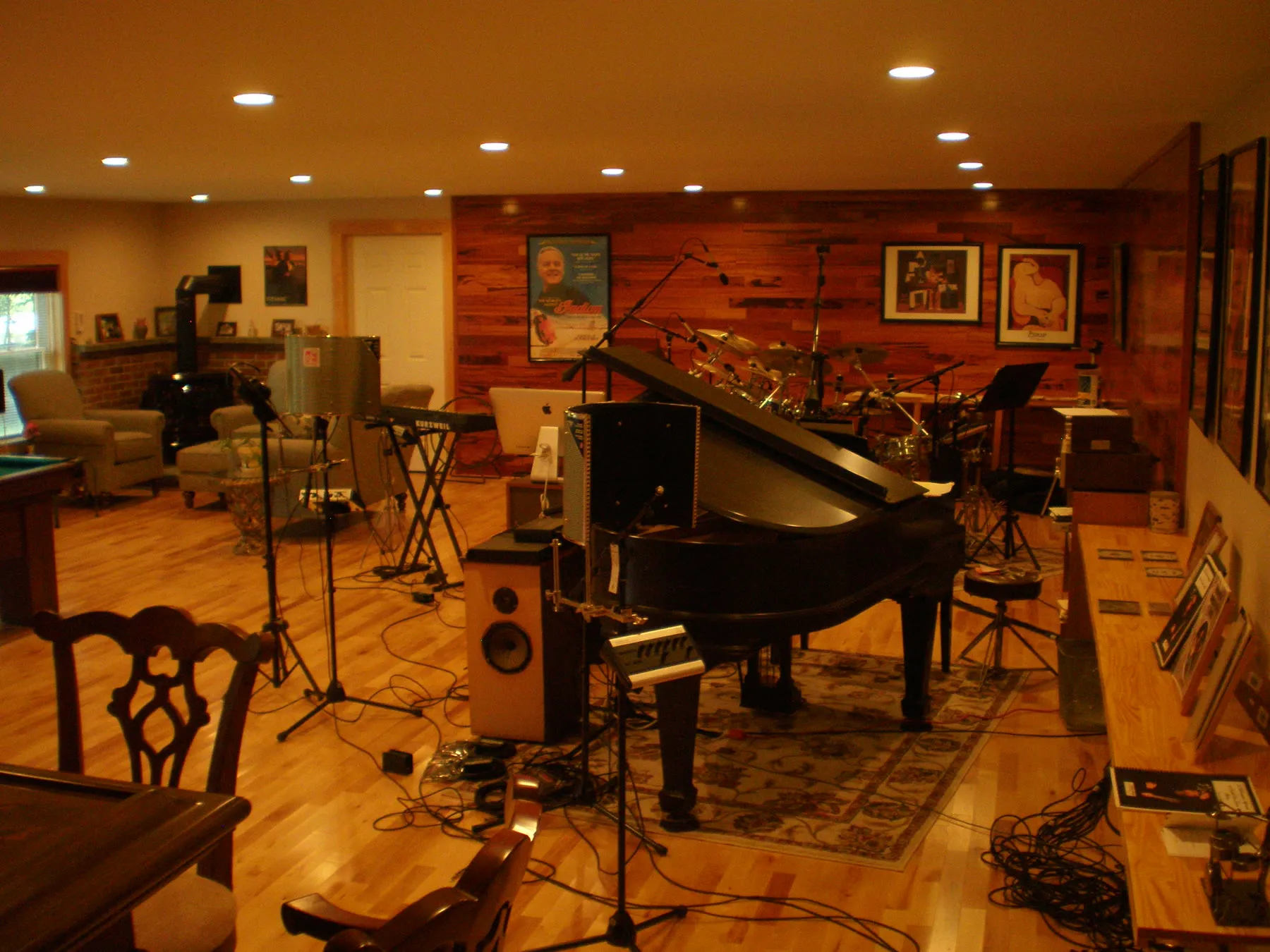 The tracking room at Ascension Recording Studios — grand piano, drum kit and keyboards